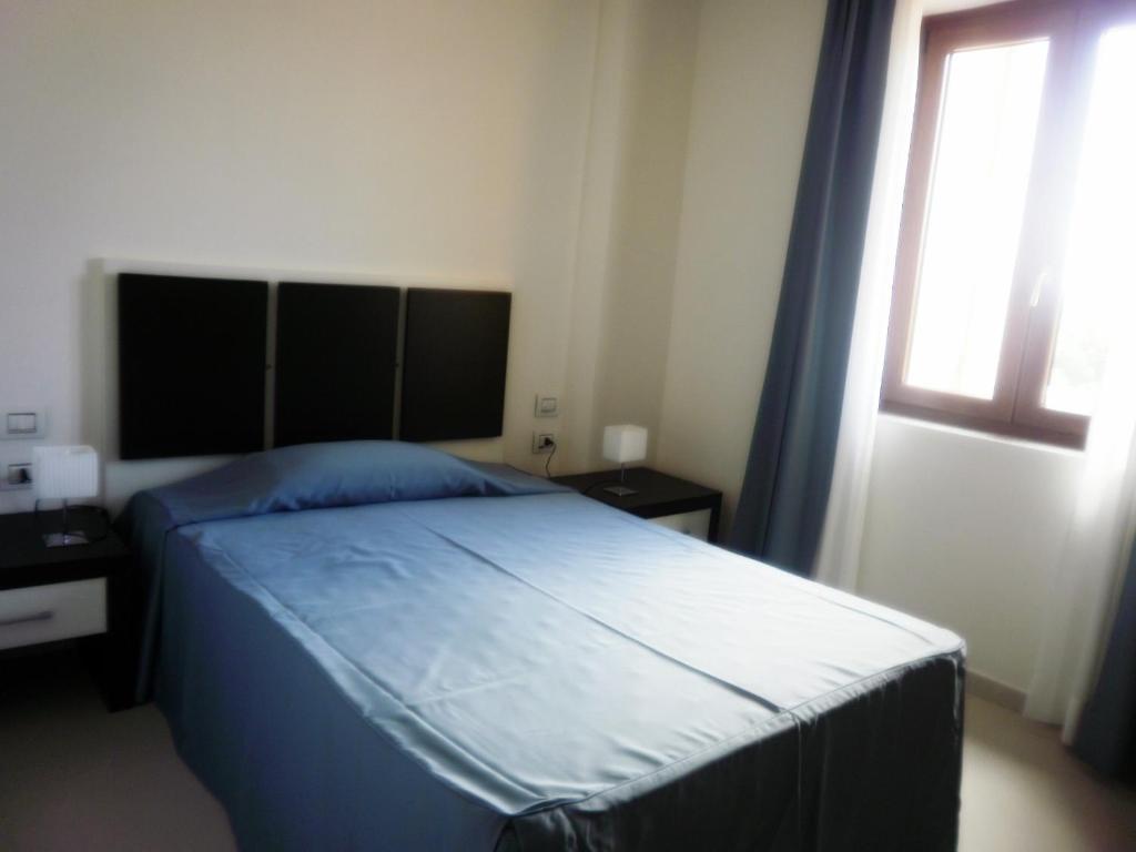 Buddi Hotel Platamona Habitación foto